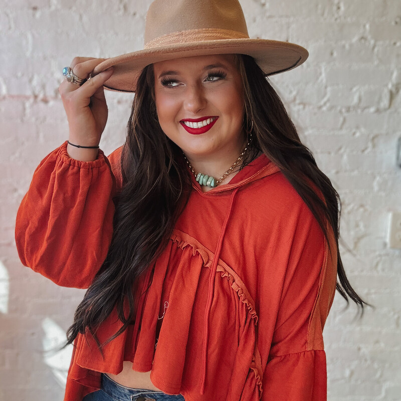 This High-Low top would be perfcet for fall weather paired with leggings or jeans and a cute little hat! Dress it up or down, you're sure to be in style!

Available in sizes Small, Medium, and Large.

Madison is wearing a size Large!