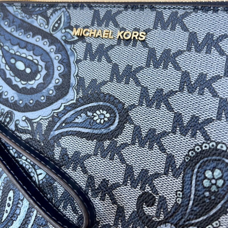 Michael Kors Paisley Wristlet<br />
Color:Blue<br />
-Kors Studio Collection<br />
-Coated Canvas<br />
-Brushed Nickel Hardware<br />
-10\"W X 6\"H X 0.75\"D<br />
-Handle 6\"<br />
-Interior: Three Card Holders<br />
-Lining: 100% Polyester<br />
-Imported<br />
Retails: 128.00<br />
This wristlet is in like new condition, with no marks or flaws.
