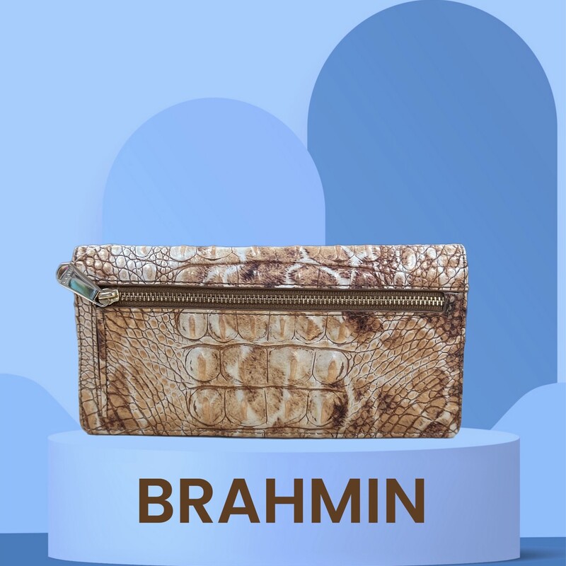 BRAHMIN<br />
The Ady Wallet is exactly what you have been searching for. Super sleek and light weight with plenty of credit card slots and a zip pocket for your change. Extremely functional with its flat design, perfect for fitting in your favorite clutch or crossbody.<br />
13 Credit Card Slots<br />
1 ID Slot<br />
7.5\" W 3.75\" H 0.5\" D<br />
Retails: $145.00<br />
This wallet is in like new condition.