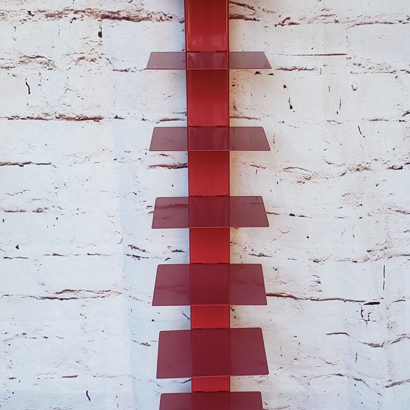 Metal Spine Bookshelf, Red. In good conditon with minimal wear. Size: 65in tall.