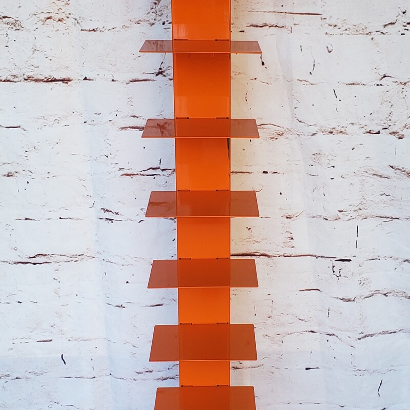 Metal Spine Bookshelf, Orange. In good condition with minimal wear.  Size: 59 in tall