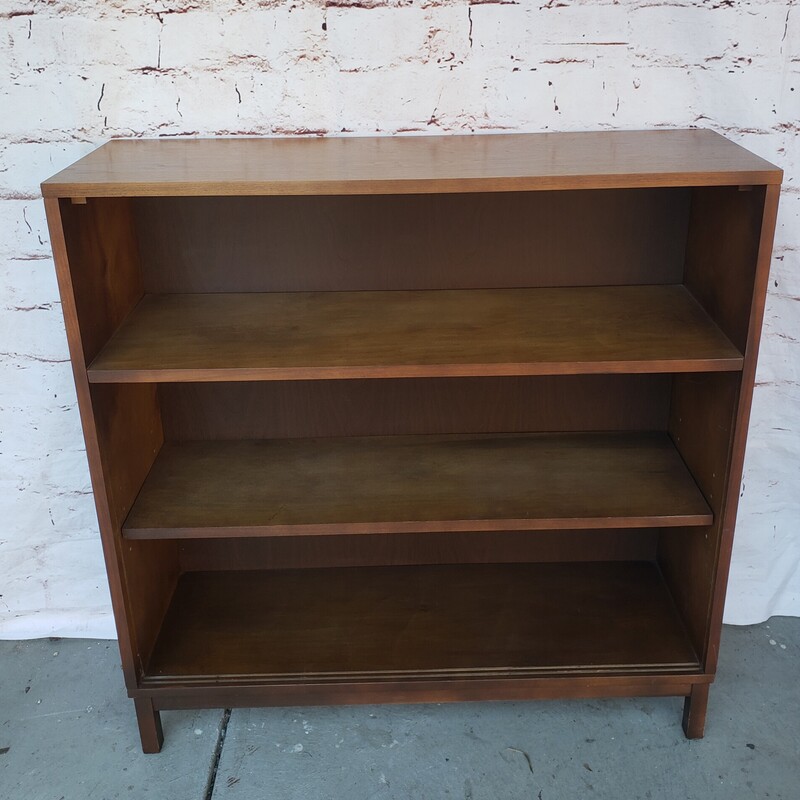 MCM Bookcase. In good condition with minimal wear. Adjustable lower shelf. Size; 38W x 12D x 39T