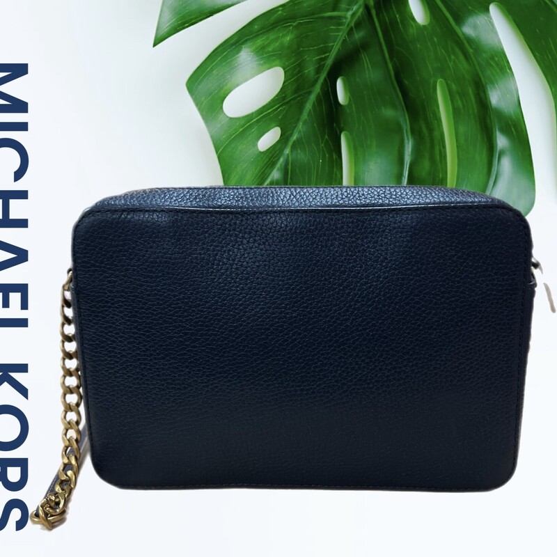 Michael Kors Leather Navy Multi Snake Jet Set Crossbody<br />
MSRP $ 228.00<br />
Approx. 9.5\" (L) x 6.25\" (H) x 2.15\" (D)<br />
Snake embossed with pebbled leather colorblocked stripes at front<br />
Zip top closure<br />
Antique-brass studs and hardware<br />
Adjustable leather with chain-detail strap approx. 23\" drop<br />
Interior features: Signature polyester fabric and leather lining<br />
1 back wall padded tech pocket and 1 slip pocket on front wall