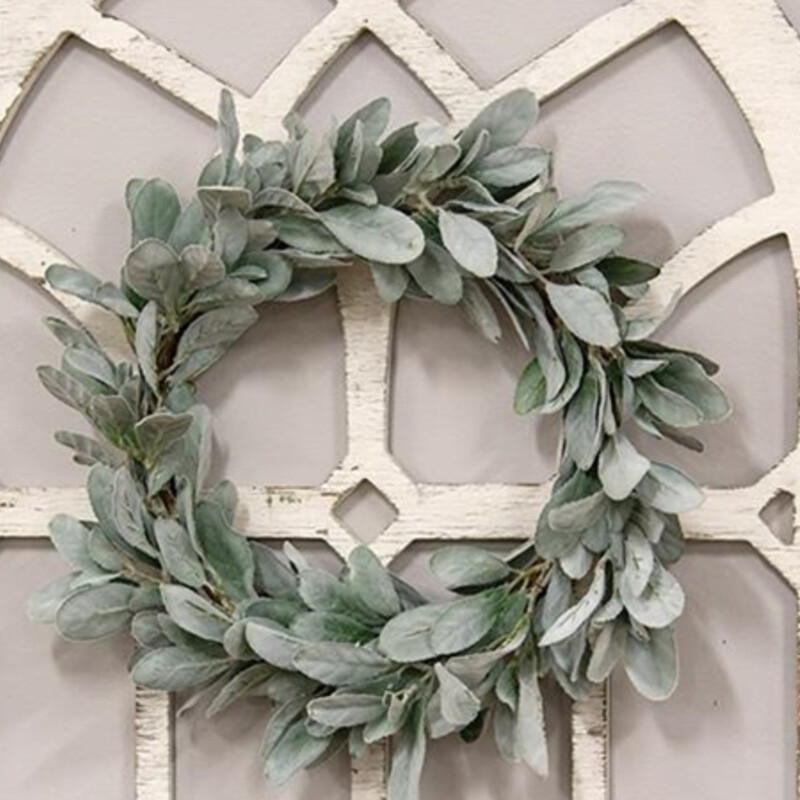 The Frosted Lambs Ear Wreath is a decorative greenery wreath with a brown wrapped base. The wreath is filled with lambs ear leaves, all with a soft, dusted coating for a freshly frosted effect. Measures 11 inches in diameter (inner) and 18-20 inches outter diameter