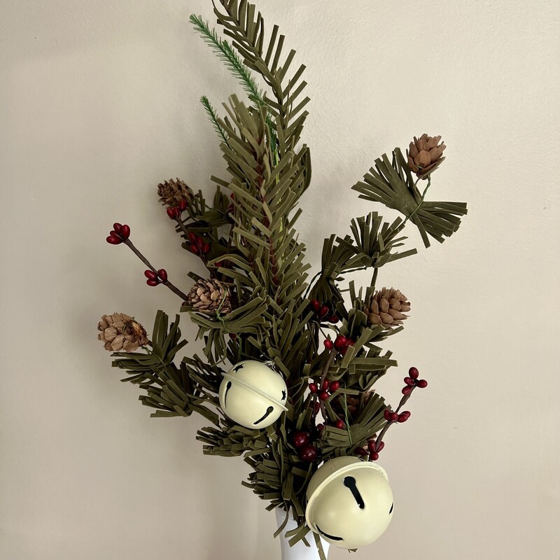 Country Bell Pine Stem has an old world blend of pine boughs, burgundy pip berries, pinecones,and oversized whitewashed bells on a green-wrapped stem.  Stem measures 16 inches high