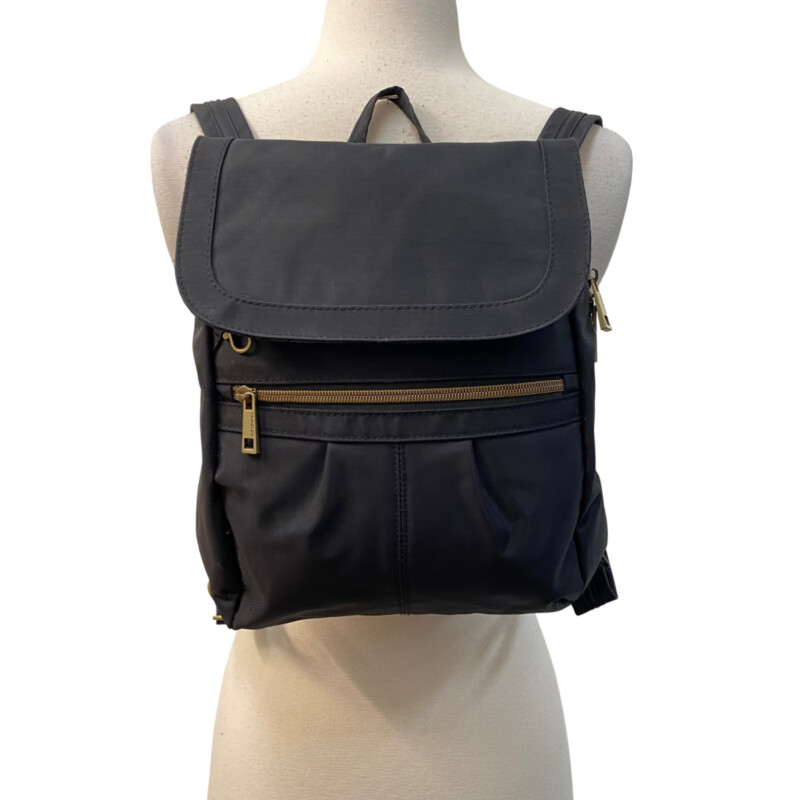 Travelon Anti-Theft Signature Backpack<br />
Ample space to carry an iPad, 2 interior zippered wall pockets and a drop pocket. The backpack is made from durable water and stain resistant nylon material with antique brass finished hardware.