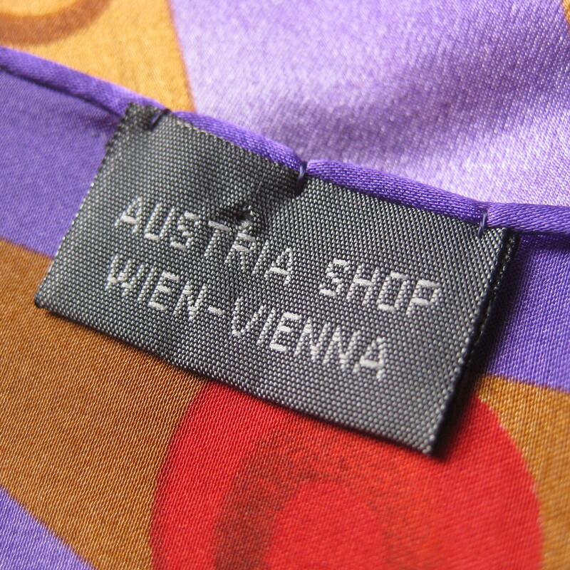 Silk Oblong, Purple, Size: None<br />
Luxurious silk scarf made in Austria.<br />
this scarf is giving Gustav Klimt with its lustrous colors and harmonious abstract shapes.<br />
Tones of purple gold red orange and blue.<br />
Depending on how you tie it you can emphasize the colors as you wish.<br />
Generous sized oblong 64 long x 16 wide<br />
Hand rolled edges<br />
<br />
Good condition,I found one faint stain as shown in the third to last picture.  I didn't try to get this out<br />
Thanks for looking!<br />
#62284