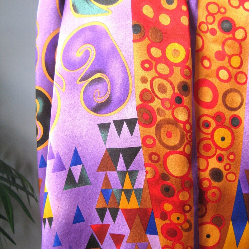 Silk Oblong, Purple, Size: None<br />
Luxurious silk scarf made in Austria.<br />
this scarf is giving Gustav Klimt with its lustrous colors and harmonious abstract shapes.<br />
Tones of purple gold red orange and blue.<br />
Depending on how you tie it you can emphasize the colors as you wish.<br />
Generous sized oblong 64 long x 16 wide<br />
Hand rolled edges<br />
<br />
Good condition,I found one faint stain as shown in the third to last picture.  I didn't try to get this out<br />
Thanks for looking!<br />
#62284
