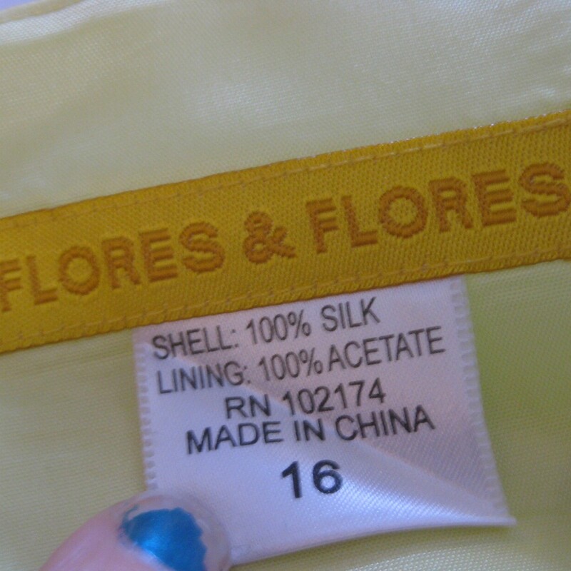 Flores & Flores Cocktail, Yellow, Size: 14<br />
<br />
Two piece gown by Flores and Flores.<br />
Lustrous 100% silk in a cool lemon yellow color.<br />
<br />
Sizing : the outfit is marked size 16 but DO NOT go by that, please use the measurements below and lmk if you have any questions before you purchase.<br />
<br />
the two pieces are:<br />
1.A floral charmeuse top with spaghetti straps, lined and with boning for support, and a zipper in the back.<br />
flat measurements:<br />
armpit to armpit: 19<br />
length of bodice not including straps: 15 in the front and 10.25 in the back<br />
2. a long plain skirt of solid yellow silk with an acetate underskirt.  More satin than charmeuse and with a bit of body<br />
Flat measurements:<br />
waist: 16.75<br />
hip: 21.75<br />
length: 43<br />
<br />
CONDITION:  two tiny issues:<br />
Excellent!  I found a tiny bit of dirt near the hem on the back of the skirt.  I didn't try anything to get it off.  Please see the photos provided.<br />
<br />
Thanks for looking!<br />
#3682<br />
<br />
This outfit comes with a long not silk oblong scarf in yellow.  It matches the yellow silk PRETTY well but not perfectly, I don't think this item is original to the gown but keeping the three pieces together for you