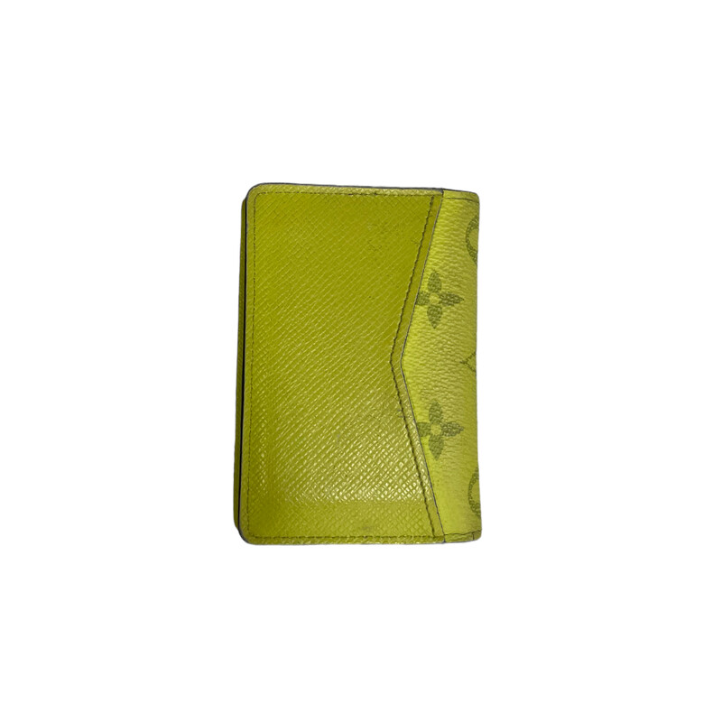 LOUIS VUITTON Monogram Taiga Pocket Organizer in Jaune. This trim card holder is made of the traditional monogram canvas in bright yellow and opens to a cross grain leather interior with patch pockets and card slots, with the luxury and style of Louis Vuitton!

Dimensions:
Base length: 3.00 in
Height: 4.50 in
Width: 0.75 in
 *Some Marks on the front