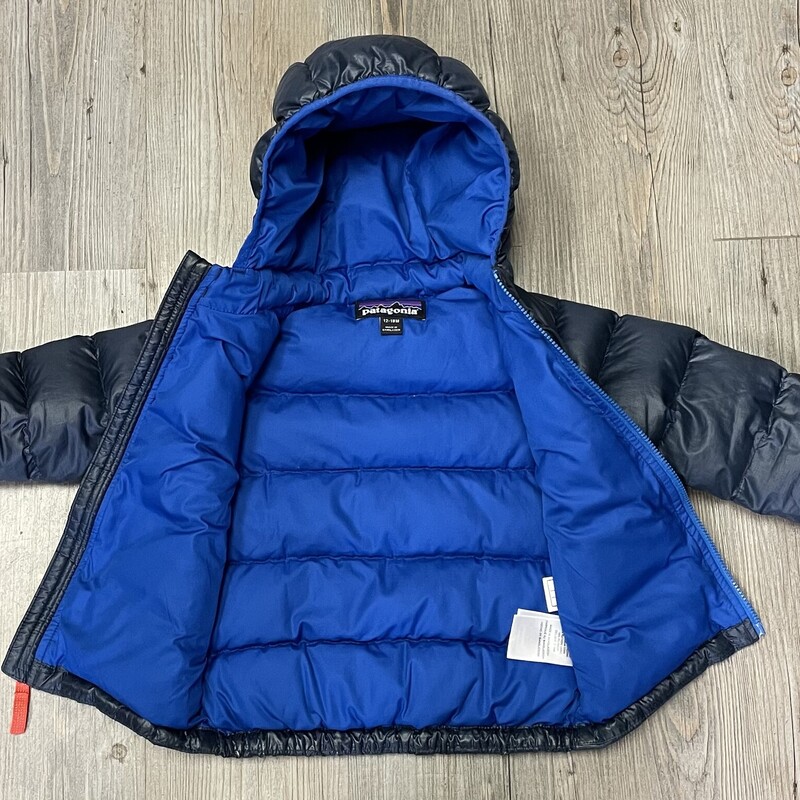 Patagonia Toddler Hi Loft Sweater Hoody, Navy,<br />
Size: 12-18M<br />
<br />
Excellent Used Condition<br />
<br />
This is our warmest down jacket for babies. It layers easily and has an insulated hoody and soft, smocked internal elastic at the cuffs to keep out drafts. The shell fabric is NetPlus® 100% postconsumer recycled nylon ripstop made from recycled fishing nets to help reduce ocean plastic pollution. Insulated with warm, compressible 700-fill-power 100% Recycled Down (duck and goose down reclaimed from down products).