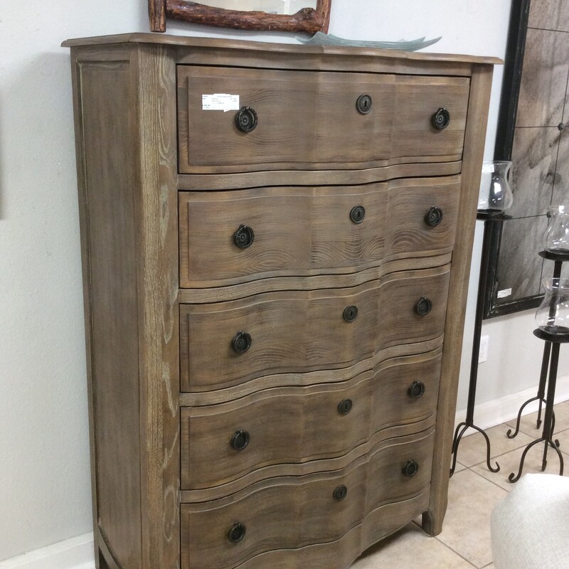 This is a very nice 5-drawer dresser from Schnadig Home Collections. It is made of oak and has been stained and distressed for that aged and weathered look. The drawers are deep and spacious.