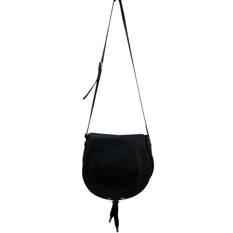 Black Chloe Marcie Crossbody
Marcie Medium Leather Saddle Bag in black leather and gold-tone hardware with dangling tassel
Fold Over Flap
Interior design details: flat card pocket
Dimensions: 13in wide x 9in high x 2.4in deep
Adjustable shoulder strap drops 22in
