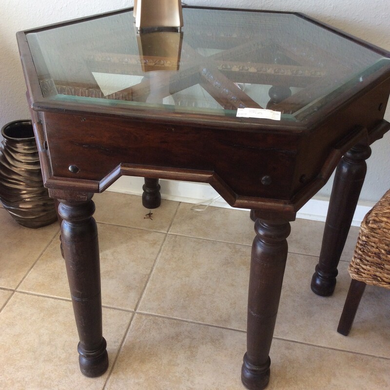 Solid dark wood hexagon talbe with a beautifully edged top overlayed with a glass piece.