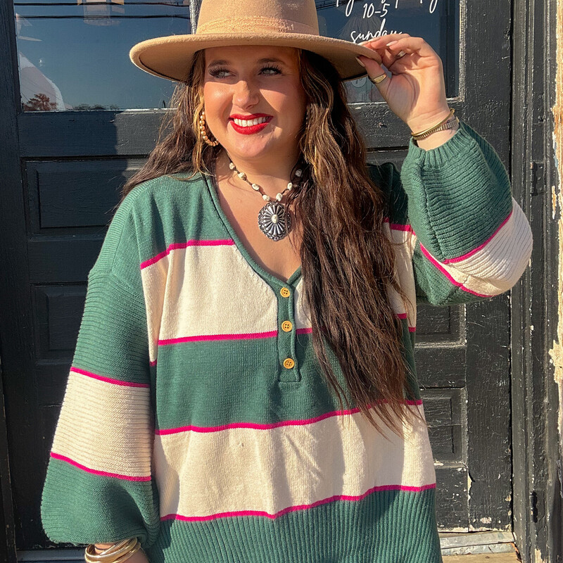 The perfect pink and emerald sweater to wear for fall, pair with jeans and a cute pair of booties!<br />
Available in sizes Small through X-Large.<br />
Madison is wearing a size X-Large.