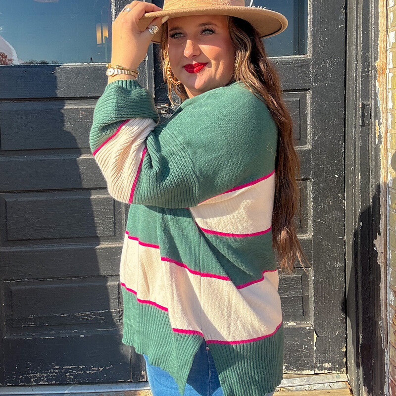 The perfect pink and emerald sweater to wear for fall, pair with jeans and a cute pair of booties!<br />
Available in sizes Small through X-Large.<br />
Madison is wearing a size X-Large.