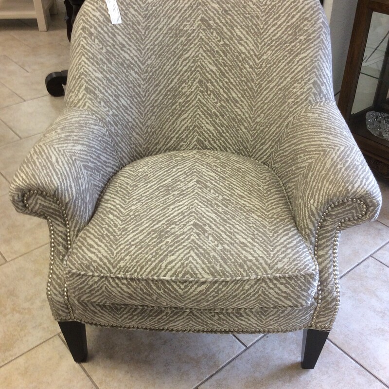 This side chair from Lauries Furniture has a chevron patterned fabric and nail head trim.