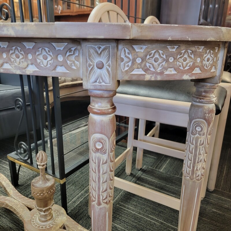 Distressed French Demilune Table in good condition.  Has ornate carvings and a white wash finish.  Measures 43' wide; 14' deep; 31' tall.