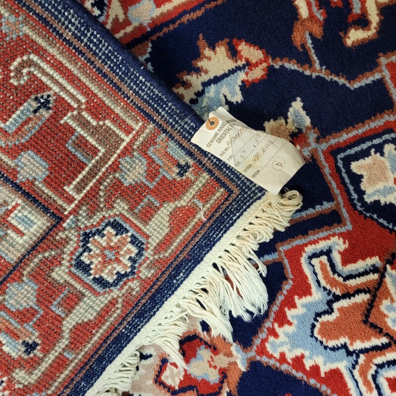 Heriz  Wool Hand Woven Dark Blue Carpet in excellent condition.   Has vibrant Reds and dark blues.  Great design!  Measures 3'3' by 5'9'.