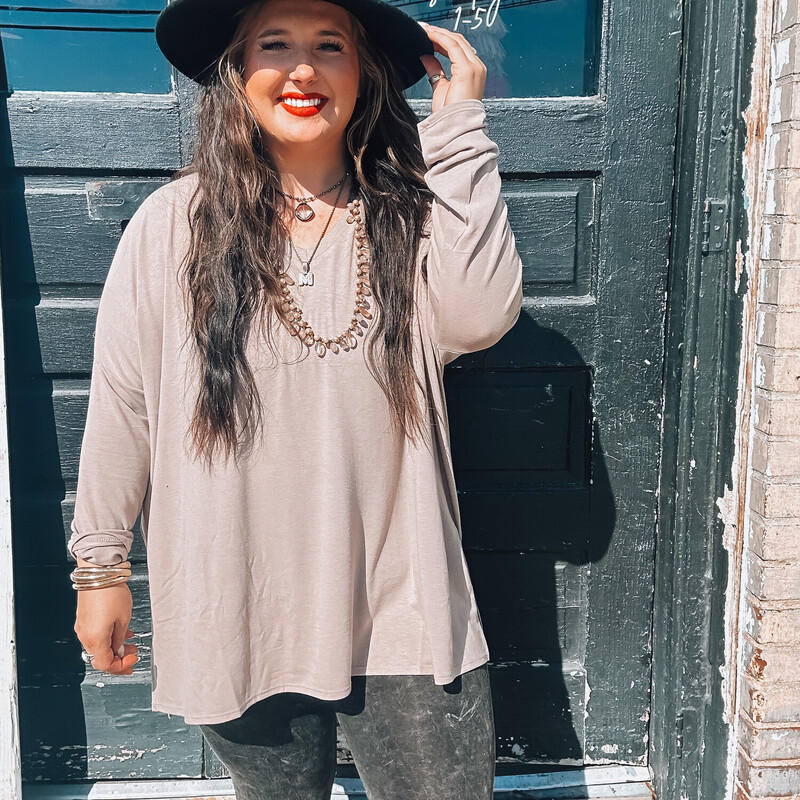 These comfy long sleeve tees are perfect for everyday wear! Dress them up or dress them down, and stay comfy! Perfect for Fall!<br />
Colors: Black, Mocha, Camel<br />
1X through 3X. Madison is wearing a 1X.