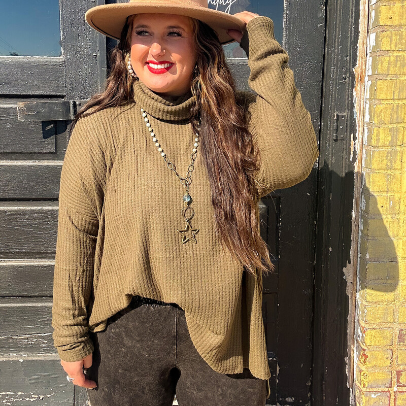Have you heard the news?! Turtle necks are IN! Keep warm and cozy in these super soft waffle sweaters this fall/winter season! Dress them up with some booties and a cute pair of distressed jeans, you will be the cutest one out!<br />
Colors: Bone, Cocoa, Camel, Burgandy, Olive, Khaki, and Mustard.<br />
Available in sizes 1X-3X. Madison is wearing a 1X.