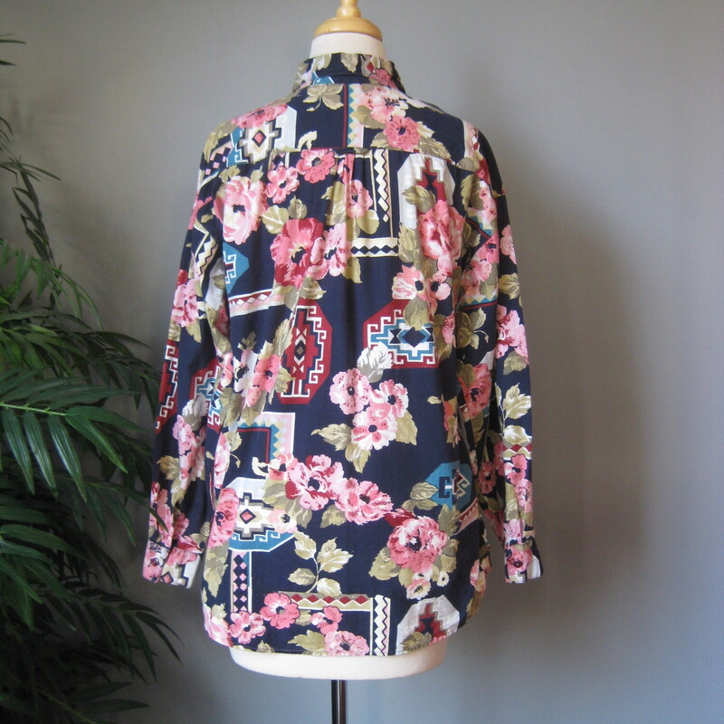 Fun busy floral 80s print shirt by Forenza. 100% cotton<br />
Navy background with big pink flowers and southwestern design elements.<br />
made in India<br />
one chest pocket<br />
<br />
<br />
Style : Long Sleeved Button down shirt with full sleeves<br />
Fabric Content : 100% cotton<br />
<br />
<br />
Marked size small, but will fit bigger see measurements below, this may have originally been a mans shirt :)<br />
Flat Measurements please double where appropriate:<br />
Shoulder to shoulder: 22 these are 'dropped'<br />
Armpit to Armpit: 22.25<br />
length: 26<br />
width at hem: 21<br />
Underarm sleeve seam: 18.25<br />
<br />
<br />
Thanks for looking.<br />
#59975