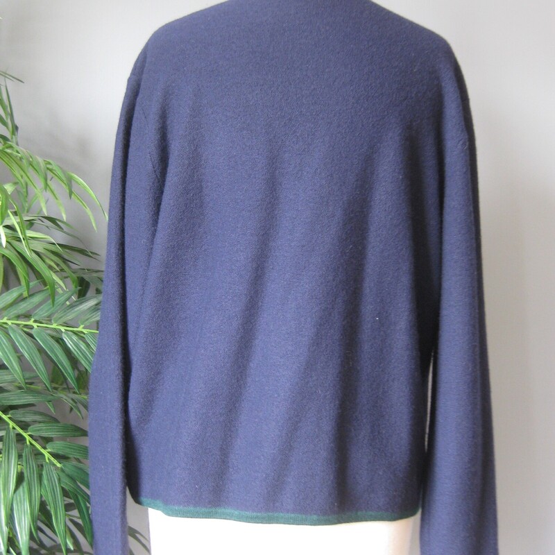 Vintage Pendleton cardigan sweater<br />
navy blue with green trim and cute tassles embroidered on the working pockets.<br />
100% Merino Wool<br />
made in Hong Kong<br />
Small gold metal buttons<br />
It's marked size XL and the wool has some stretch:<br />
flat measurements:<br />
shoulder to shoulder: 18.75<br />
armpit to armpit: 22.5<br />
width at hem, buttoned and unstretched: 20<br />
length: 23<br />
underarm sleeve seam: 15.5<br />
sleeve from shoulder seam to the end: 23<br />
<br />
excellent condtion, no flaws!<br />
<br />
thanks for looking!<br />
#55004