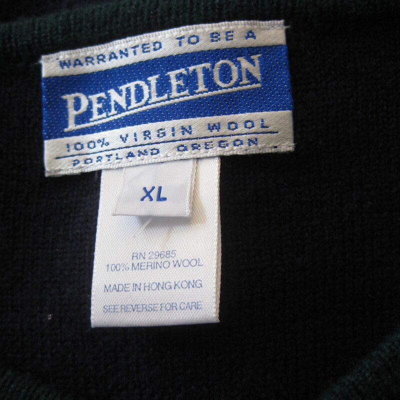 Vintage Pendleton cardigan sweater<br />
navy blue with green trim and cute tassles embroidered on the working pockets.<br />
100% Merino Wool<br />
made in Hong Kong<br />
Small gold metal buttons<br />
It's marked size XL and the wool has some stretch:<br />
flat measurements:<br />
shoulder to shoulder: 18.75<br />
armpit to armpit: 22.5<br />
width at hem, buttoned and unstretched: 20<br />
length: 23<br />
underarm sleeve seam: 15.5<br />
sleeve from shoulder seam to the end: 23<br />
<br />
excellent condtion, no flaws!<br />
<br />
thanks for looking!<br />
#55004
