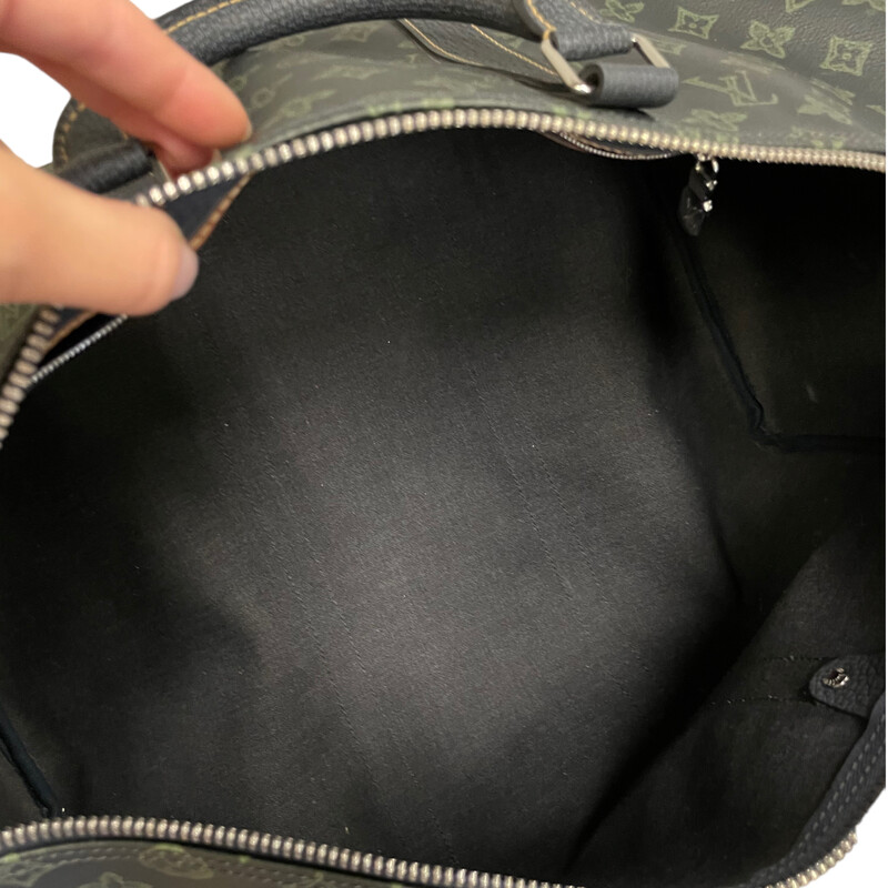 Louis Vuitton Textile Keepall Size45<br />
Limited Edition 2022<br />
Features the iconic dark green monogram pattern on a dark canvas background, giving it a vintage and trendy feel. The chunky updated tanned leather LV initials are sewn onto the canvas<br />
Dimensions: 17.7 x 10.6 x 7.9 inches<br />
                        ( length x Height x Width)