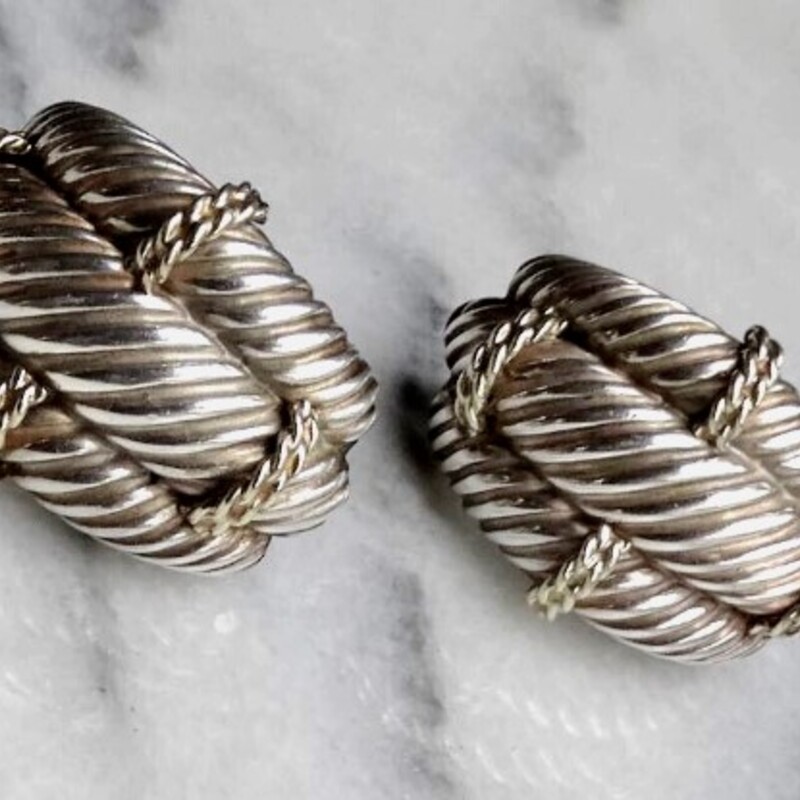 David Yurman14K Sterling Earrings<br />
Silver Gold<br />
Size: .77x1.2H<br />
Sterling Silver triple cable 14K Gold accented earrings<br />
Clip-on style