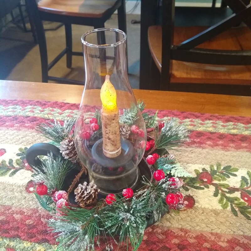 Christmas Candle Holder

Candle holder with xmas ring and battery operated timer candle.  Twist bottom to turn on candle and it will stay on for 6 hrs, off for 18 hrs and will come on automatically each day.
