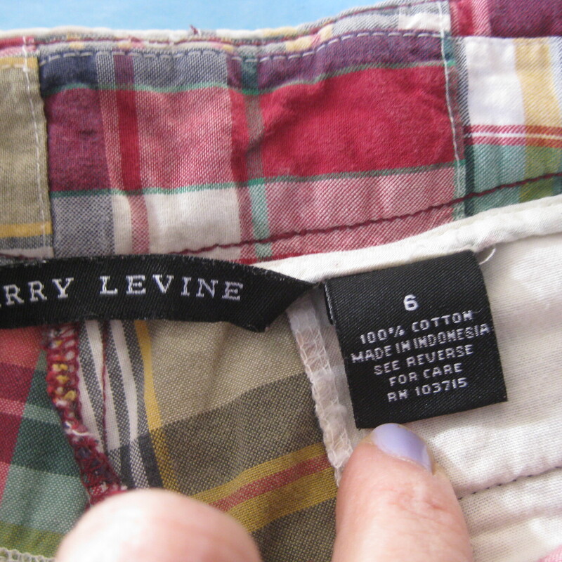 Larry L Plaid Bermuda, Red, Size: 6<br />
Summery Bermuda shorts by Larry Levine.<br />
Pieced cotton patchwork , not just a patchwork print.<br />
Colors present are red and white with touches of yellow and gren<br />
side and back pockets<br />
adjustor tabs and buttons at the waist<br />
marked size 6.  pls  use measurements below to be certain they'll fit you.<br />
Panst sliding hook and eye and zipper fly<br />
Excellent condition, no flaws<br />
100% cotton made in Indonesia<br />
<br />
Marked size 6<br />
flat measurements:<br />
waist: 15.5 can be made a bit smaller here using the side adjustor buttons and tabs<br />
hip: 19<br />
rise: 9.75 (mid rise)<br />
inseam: 12.5<br />
side seam<br />
<br />
thanks for looking!<br />
#61800