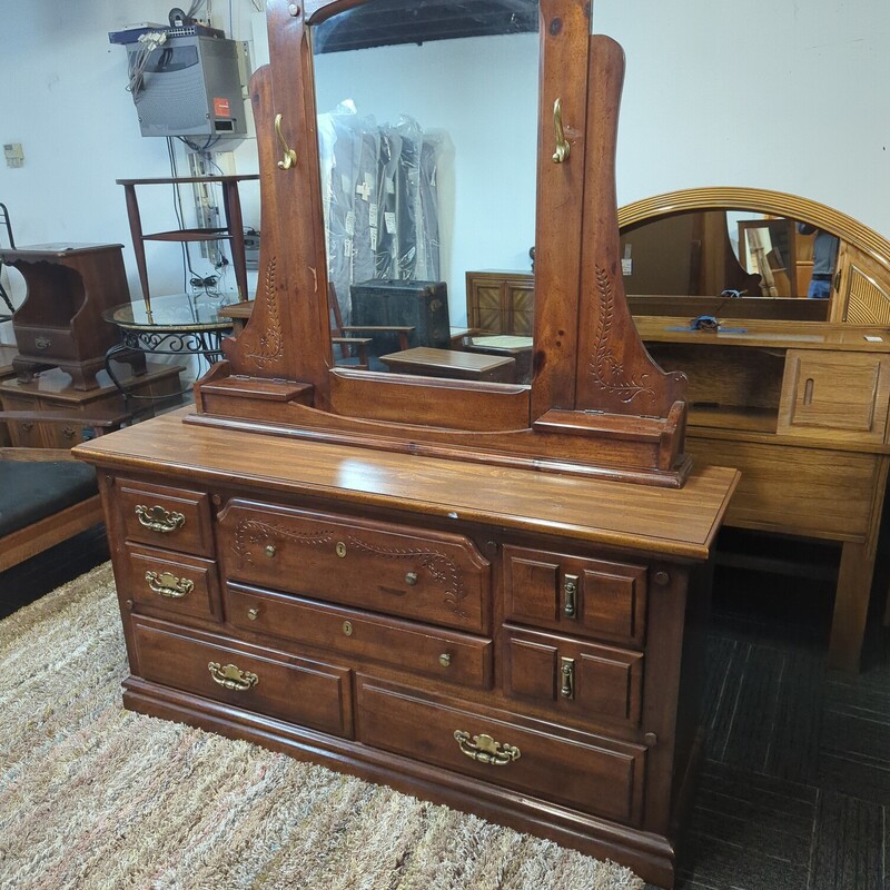 Vintage dresser with mirror. 64in wide 18in deep 33in high.