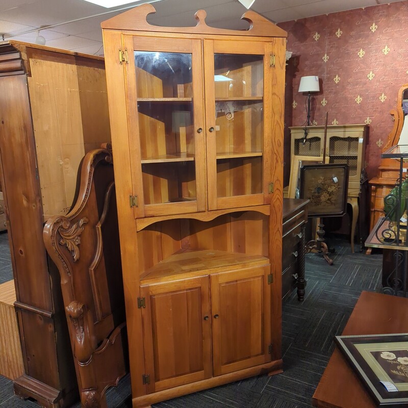 Pine corner cabinet. Has some finish wear. 38in wide 18in deep 7ft high.