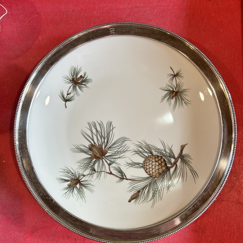 Sterling Pinecone Plate
Size: 12 In Round
Beautiful Rosenthal Pinecone plate with sterling silver rim.  It is made in Germany.  Wouldnt this look fabulous with Christmas cookies on it!