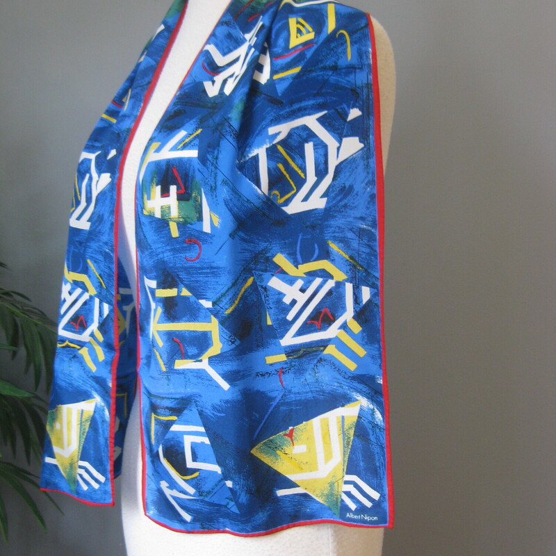 Artsy lighweight scarf depicting (imho) impressionistic views a summer seascape with blue sea and sky and yellow sails
The scarf is done in primary colors blue, yellow and white and bordered in grounding red.
Long oblong can be worn a number of ways.
Silk
Pefect condition.

Thanks for looking!
#65704