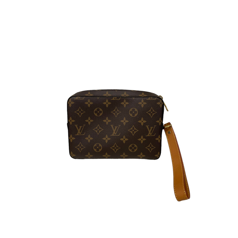 Limited Edition<br />
LOUIS VUITTON Monogram Soft Trunk Pouch. This stylish clutch is crafted of monogram coated canvas. The clutch features gold hardware, vachetta leather trim, and an optional vachetta wristlet strap. The top zipper opens to an interior of cocoa brown fabric with card slots and a patch pocket.<br />
Year:2019<br />
Dimensions:<br />
Base length: 8.25 in<br />
Height: 5.50 in<br />
Width: 1.75 in