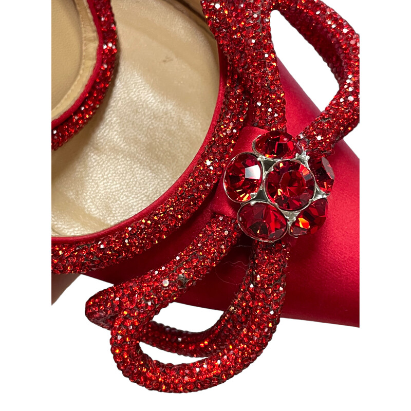 Mach & Mach Red Bow Heels<br />
Tonal crystals sparkle around the double bow<br />
 Silk-satin pointy toe and ankle strap<br />
4 (100mm) heel Adjustable ankle strap with buckle closure Textile upper/leather lining and sole<br />
Made in Italy