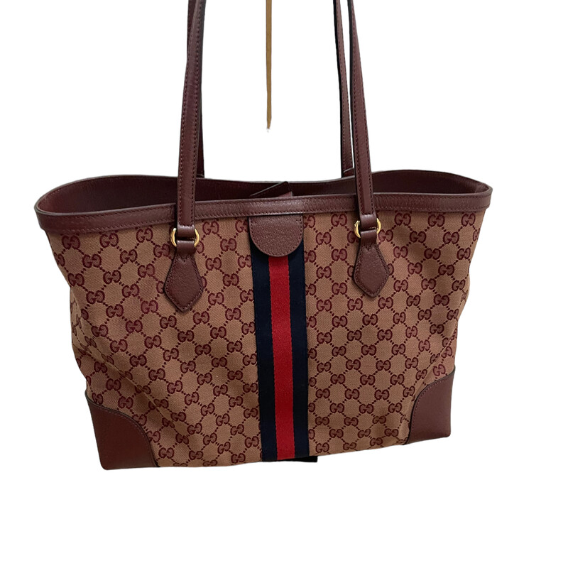 Gucci Ophelia Maroon Tote<br />
<br />
Dimensions: 14.5 x 10.5 x 5.25 (LWH)<br />
Double-handle drop: 10<br />
<br />
The world of Ophidia continues to evolve with new interpretations each season. The medium tote is reintroduced as a part of the Aria collection in a vintage-inspired color palette of beige and burgundy. The softly structured bag is completed by Double G hardware, a contemporary take on a Gucci archival belt buckle from the '70s.