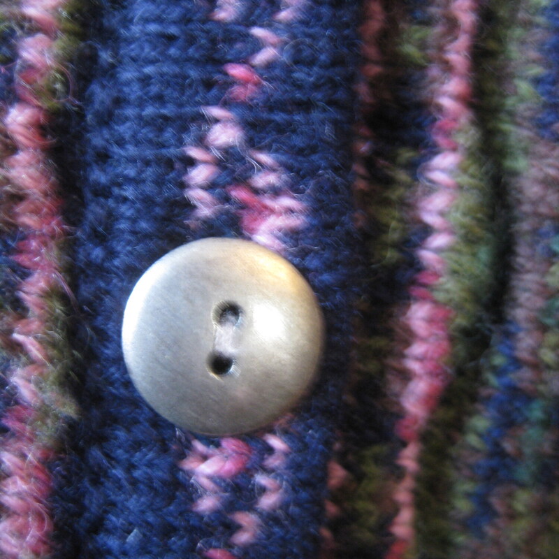 Tulchan Wool Cardigan, Navy/Pnk, Size: M/L<br />
Vintage Tulchan cardigan sweater<br />
navy blue with that coogi like vertical design on the front and back.<br />
the front is further decorated with floral embroidery.<br />
Simple metal buttons (there is an extra one on the inside)<br />
100% Wool<br />
<br />
It's marked size M/L<br />
flat measurements:<br />
shoulder to shoulder: 22.5<br />
armpit to armpit: 22.75<br />
width at hem, buttoned and unstretched: 20.5<br />
length: 27.75<br />
underarm sleeve seam: 18.5<br />
excellent condtion, no flaws!<br />
<br />
thanks for looking!<br />
#68314
