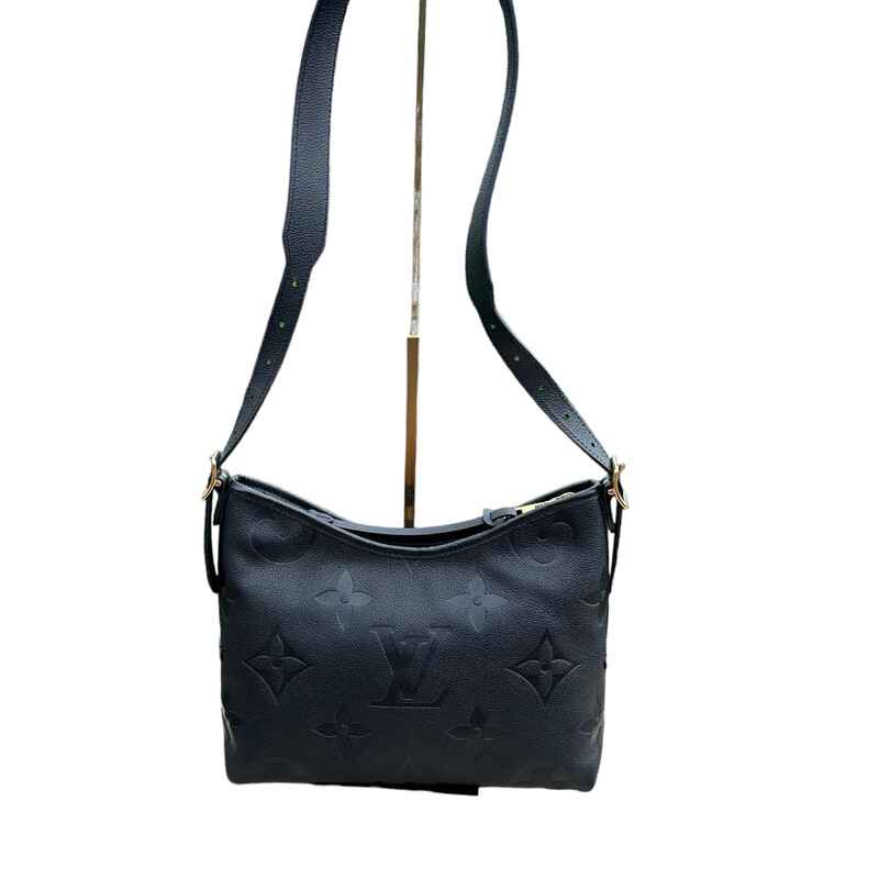 Louis Vuitton Carryall, Black, Size: PM<br />
This shoulder bag is crafted of Louis Vuitton monogram-embossed calfskin leather in black. The bag features an adjustable shoulder strap and gold hardware. The top zippers open to a blue microfiber interior with a zipper pocket.<br />
Dimensions:<br />
Base length: 10.75 in<br />
Height: 9 in<br />
Width: 4.75 in<br />
Drop: 12 in
