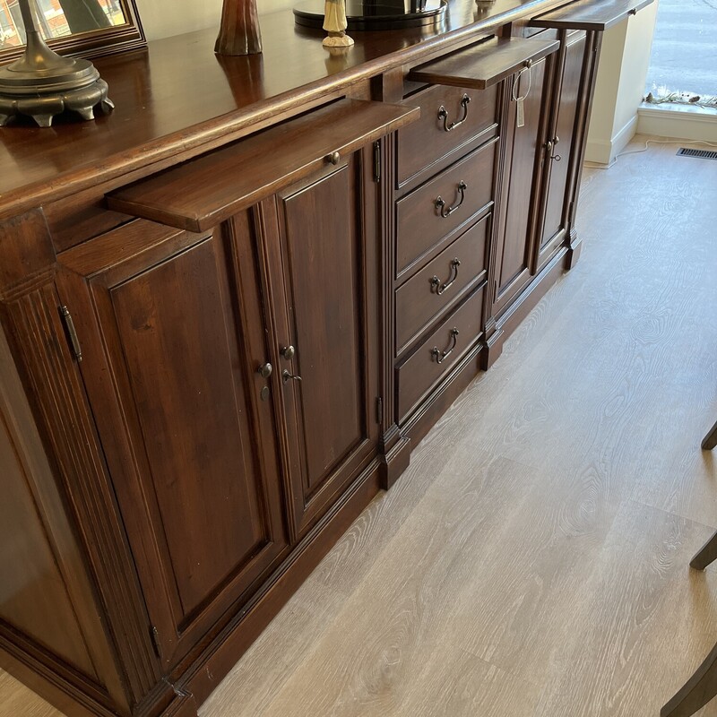 Custom Made Buffet / Sideboard<br />
Solid Wood Construction<br />
Brown<br />
Size: 97L  X 21D X42H In<br />
2 Locking Cabinets With 3 Shelves<br />
4 Drawers<br />
3 Serving Boards