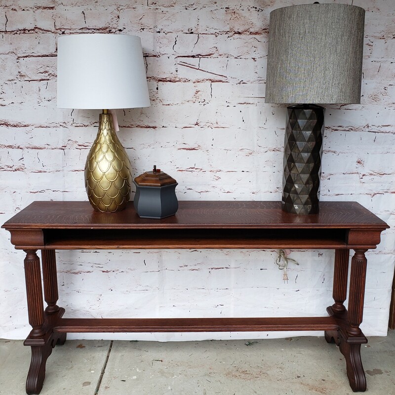 Antique Entry or Sofa Table. Has storage shelf on one side. Size: 56L x 13.5D x 27T