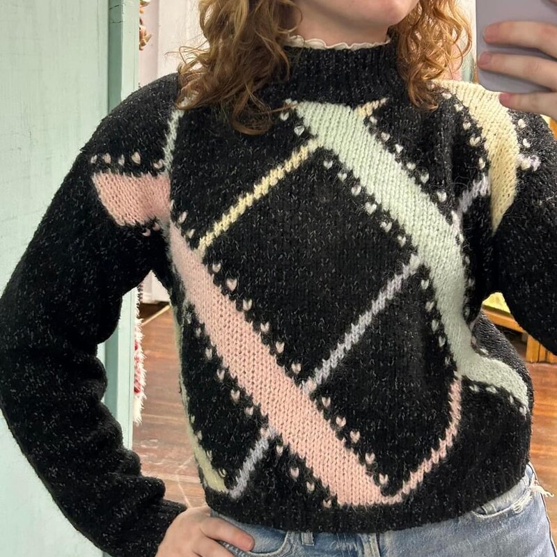 80s cropped sweater<br />
how cute is this!!!<br />
Charcoal sweater with wide & thin stripes in aqua, pink & yellow trimmed with little hearts.<br />
has a mock turtleneck, shoulder pads<br />
material feels like an acrylic blend<br />
<br />
flat lay measurements<br />
~chest...20.5<br />
~waist...15-17<br />
~length...19<br />
<br />
size medium