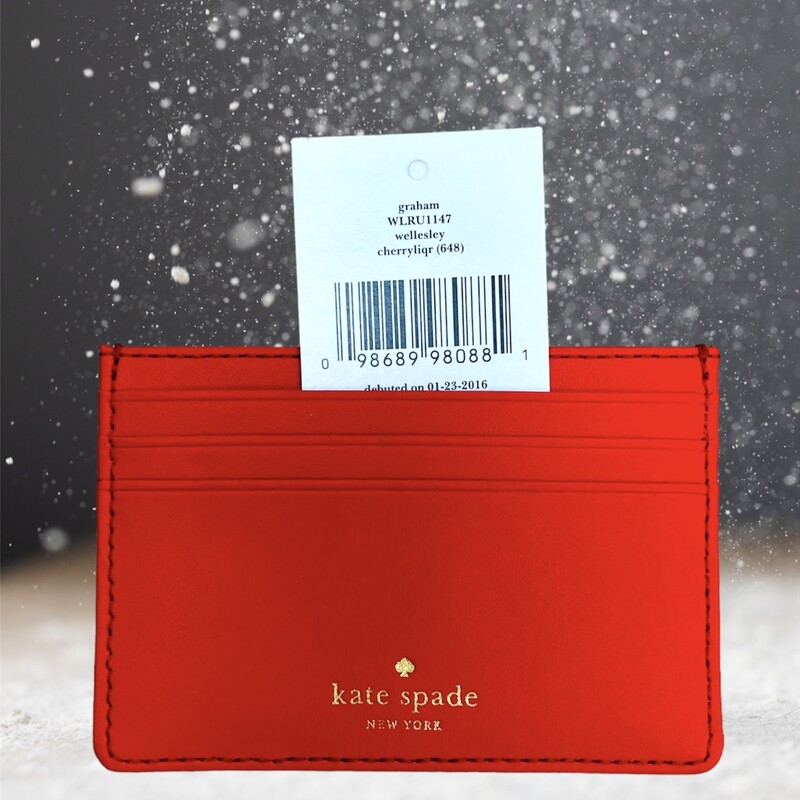 KATE SPADE<br />
<br />
kate spade New York - graham wellesley red leather card case/holder.<br />
<br />
Measures approximately 4.375\" x 3\".  Item is in new and never used condition, with original retail tag of $48.00