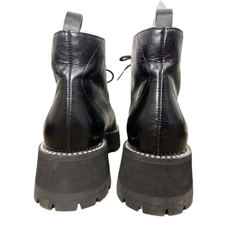 JIMMY CHOO Calfskin Crystal Embellished Colby Combat Boots  in Black. These boots are crafted of calfskin leather. They feature a 2-inch rubber heel, black lace-ups, and and crystals embellished around the welt<br />
Size 38 .