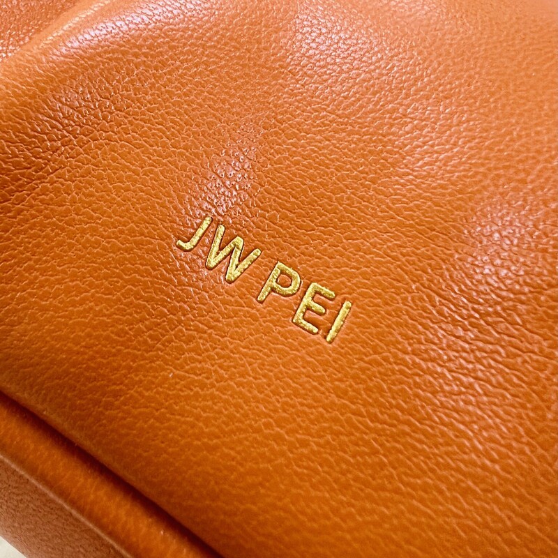 JW PEI
GABBI RUCHED HOBO HANDBAG - ORANGE
The JW PEI Gabbi Bag has a distinct minimalist ’90s vibe, created with sustainable soft vegan leather made from recycled plastic bottles. The croissant-shaped hobo bag was seen on IT Girls such as Gigi Hadid, Hailey Bieber, Emily Ratajkowski, Irina Shayk, and Megan Fox.
Material: Vegan leather + recycled plastic bottles
Silhouette: Hobo
Disclosure: Magnetic Closure
Compartment: 1 compartment
Side pockets: 1 Interior Pocket
Strap: Undetachable Strap (Unadjustable)
Lining: Faux Suede Lining
 Animal Free, Cruelty Free
Bag Dimensions: 9.6'' W × 4.7'' H × 2.4'' D (24.5cm x 12cm x 6cm)
Handle Drop: 5.1\"(13cm)
Retails: 89.00
This small bag is in like new condition with no mark or flaws.