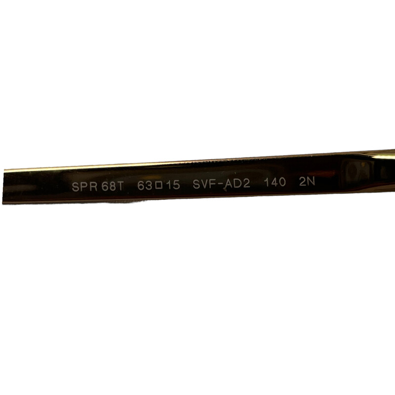 Prada Cat Eye Rose Gold<br />
<br />
Model: SPR68T<br />
Style: Fashion Cat Eye<br />
Gender: Women's<br />
 Front Material: Metal<br />
Temple: Metal<br />
Bridge Design: Saddle Bridge<br />
<br />
* Light Scratching throughout the lens