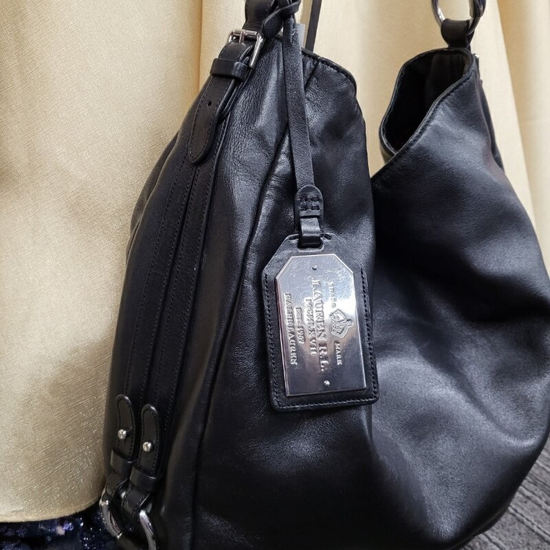 Brand New Condition! This bag is gorgeous! Super soft leather with shoulder strap and canvas lining, Magnetic closure, Inside zipper pouch and snap closure section & two slip pockets