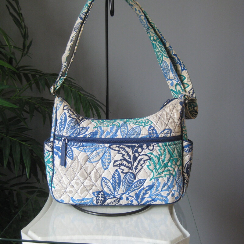 Vera Bradley Matching Wal, Blu/gren, Size: None<br />
This roomy crossbody bag by Vera Bradley is from 2017, in the Santiago pattern.<br />
Very long adjusttale shoulder strap.<br />
Outside zippered pockets and two side slip pockets.<br />
Inside there are slip pockets and one zippered pocket.<br />
11.5 x 8.5 x 4.25 (at the bottom)<br />
Strap adjusts from a 14.5 drop to a maximum 30 drop<br />
<br />
The matching wallet is included.  it has a turn lock closure and a zip around compartment.  The is space for cards, bills, receipts, ID.  It also has an outside zippered pockets.  8 x 5<br />
<br />
Both in great pre-owned condition.<br />
<br />
thanks for looking!<br />
#4212